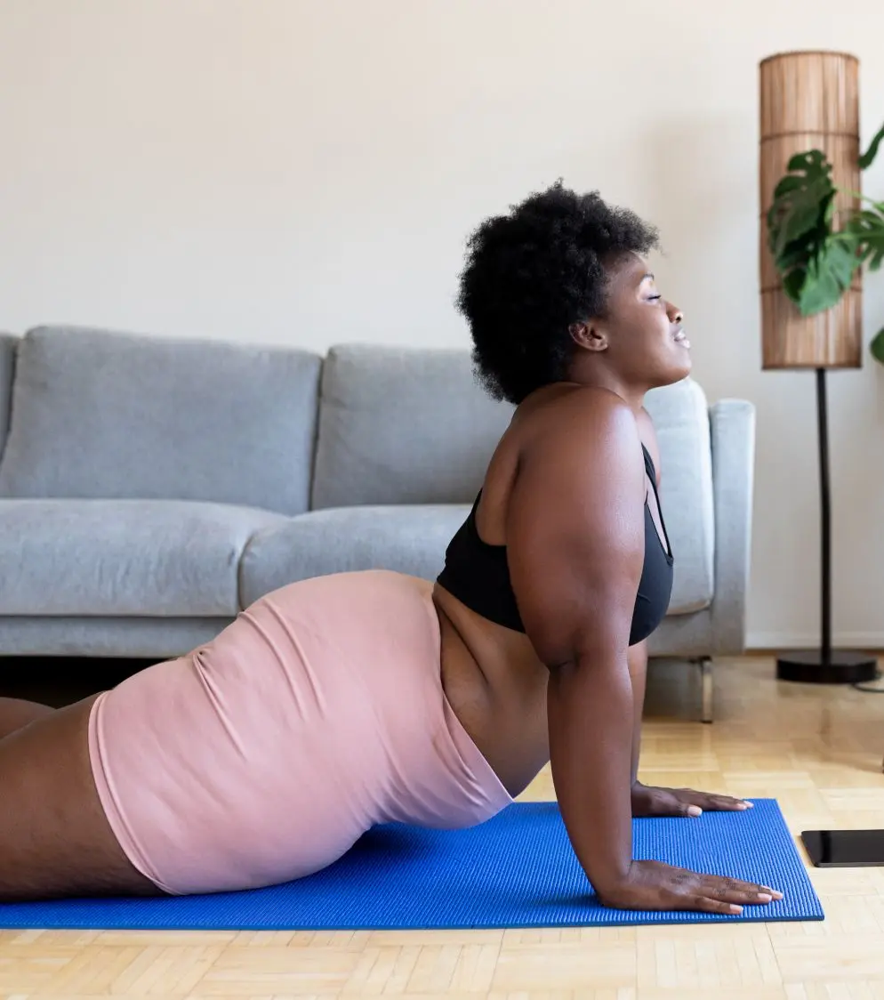 Woman doing yoga in a living room